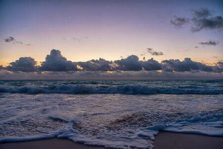 Sunset on the Caribbean Sea. Buildings in the distanceの写真素材