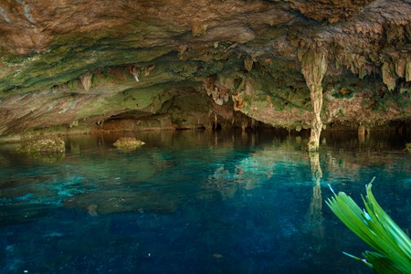 Cenote Dos Ojos with clear blue waterの写真素材