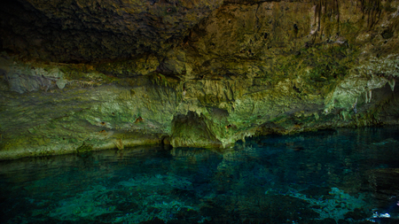 Cenote Dos Ojos with clear blue waterの写真素材