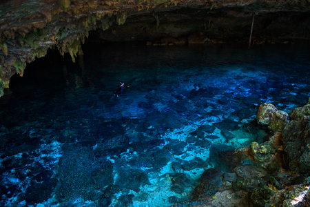 Cenote Dos Ojos with clear blue waterの写真素材