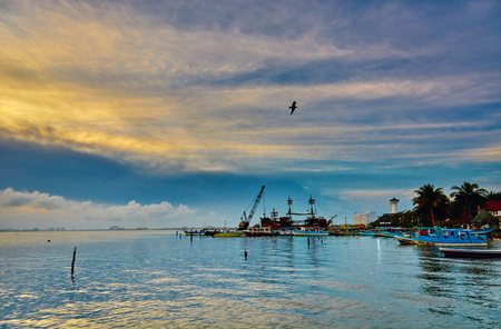 Sunset on the Caribbean Sea. Buildings in the distanceの写真素材