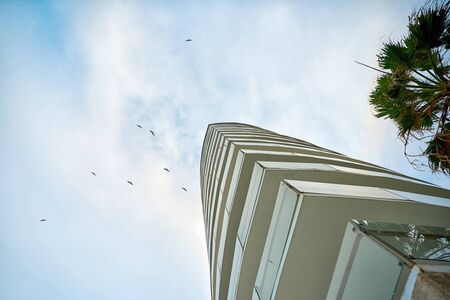 Skyscraper against the sky. Bottom view.の写真素材