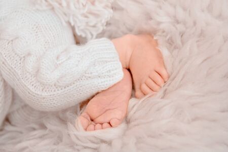 Newborn baby feet, Photo of newborn baby feet, soft focus.
