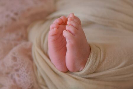 Newborn baby feet, Photo of newborn baby feet, soft focus.