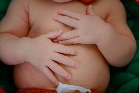 Hand of the newborn in a beautiful pose. Close-up.の写真素材