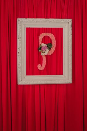 Vintage letter P on the wall in a frame.の写真素材