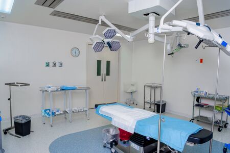 The operating room in the hospital with all the equipment. in white and blue.