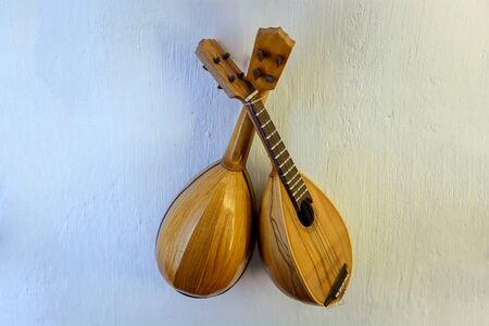 Lute - a stringed musical instrument with frets on the fretboard and an oval body.の写真素材
