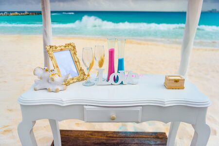 White table for a wedding ceremony on the seashore.の写真素材