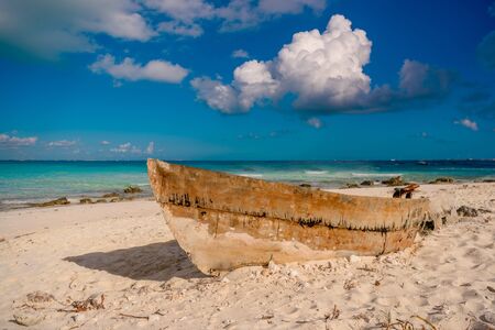 Old boat on the beach in Cancun.の写真素材