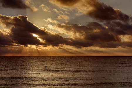 Sea beach with sky sunset or sunrise. Clouds over the sunset sea. Sunset at tropical beach. Nature sunset landscape of beautiful tropical sea.の写真素材