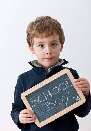 School boy with a writed blackboard