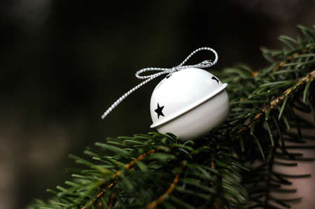 Jingle bells on Christmas tree with copy space. Selective focus.の写真素材