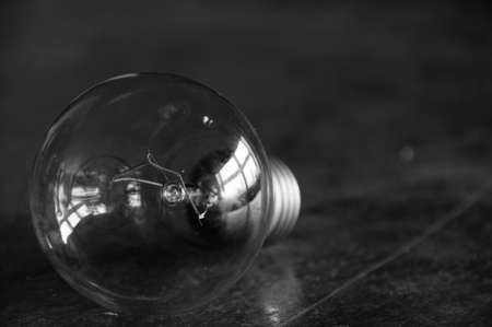 Still life of light bulb on wooden table.の写真素材