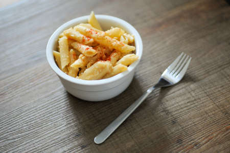 Tasty pasta bowl with parmesan.の写真素材