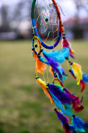 Mystic colorful dream catcher, boho vintage decoration. Nature background, details.の写真素材