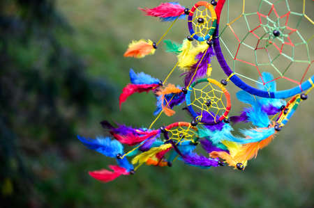 Mystic colorful dream catcher, boho vintage decoration. Nature background, details.の写真素材