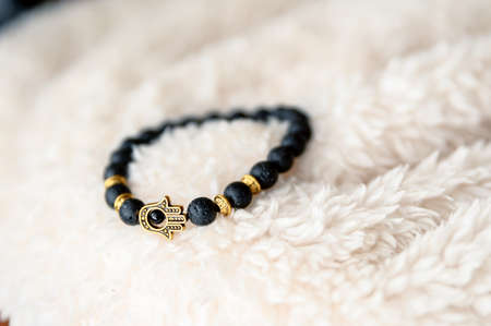 Cool design black bracelet with hamsa hand symbol.の写真素材