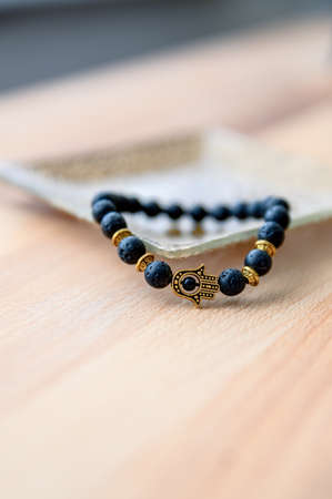 Cool design black bracelet with hamsa hand symbol.の写真素材