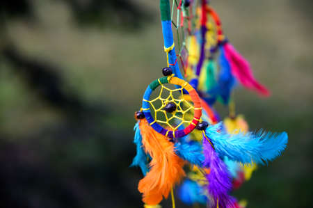Mystic colorful dream catcher, boho vintage decoration. Nature background, details.の写真素材