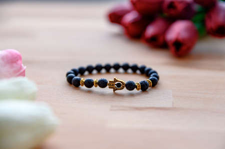 Cool design black bracelet with hamsa hand symbol.の写真素材