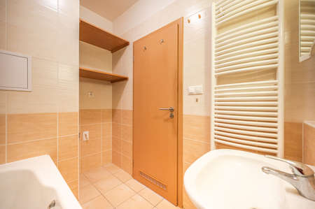 Bathroom and toilet in an apartment for rent. Real estate photo.