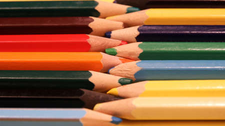 Colored pencils on a white background close up in macro photography. Art set of pencils with free space.の写真素材