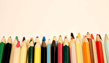 Colored pencils on a white background close up in macro photography. Art set of pencils with free space.の写真素材