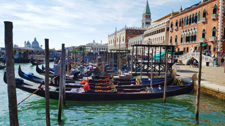 View from the Canal di San Marco on Doge's Palace and the Campanile in Venice, Italy. Gondolas moored by Saint Mark square. Architecture and landmarks of Veniceのeditorial素材