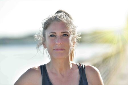 young woman doing her stretching after her joggingの写真素材