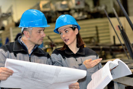 Female engineer is not happy about a fault she found in an industrial documentの写真素材