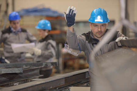 Concentrated workers realizing a act of precision in a secure environmentの写真素材