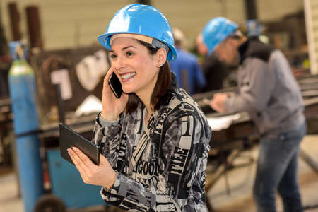 Happy male engineer and female supervisor showing and ok and thumbs up sighの写真素材