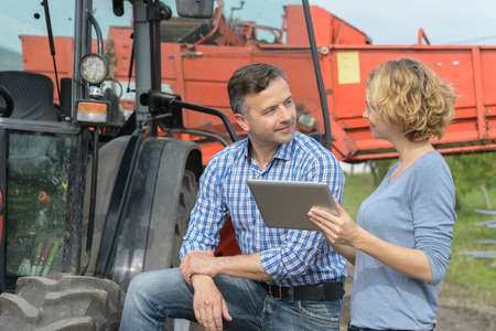 Male and female agronomist working with new technologiesの写真素材