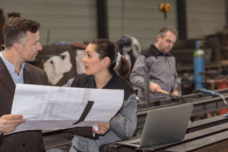 Worker and supervisor are discussing some plan ideasの写真素材