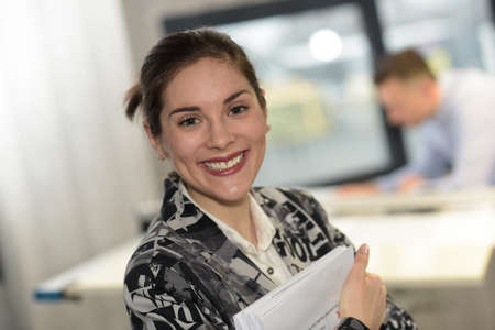 Female worker is excited about her new jobの写真素材