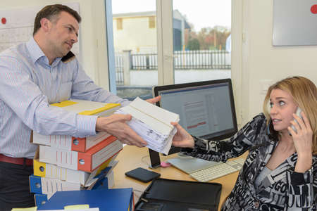 Stress and work overload in the workplaceの写真素材