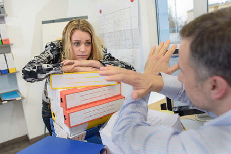 Stress and work overload in the workplaceの写真素材