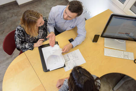 Couple signing a loan to the bank
