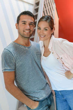 Portrait of a cute young couple in their new homeの写真素材