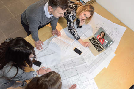 Team of architects working together on a new construction projectの写真素材