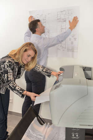 printing plans on a large format printer in a reprography workshopの写真素材