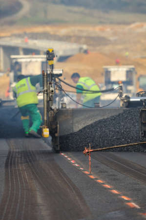 View of bitumen activity to repair a road