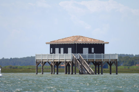 View of a wood house in the middle of the see on the coast.の写真素材
