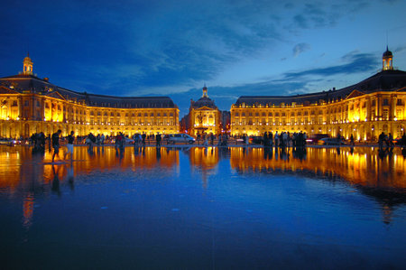Unusual view with reflection of a place in the city during the nightの写真素材