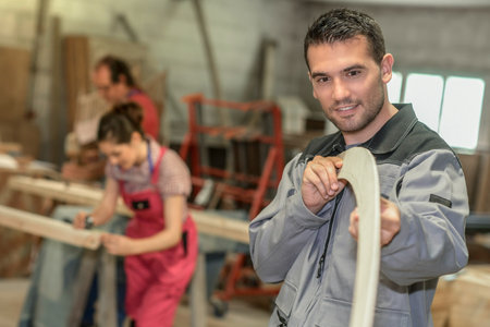 Carpenters checking their production in the workshopの写真素材