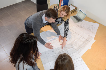 Team of architects working together on a new construction projectの写真素材
