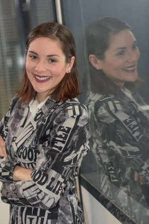 Smiling business woman is looking at the cameraの写真素材
