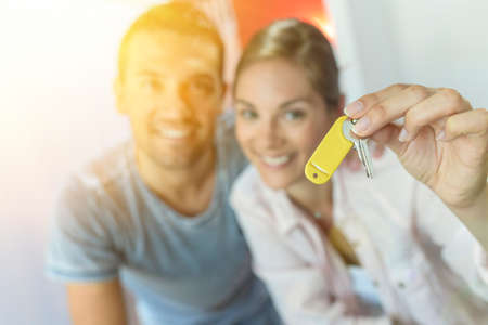 Portrait of a cute young couple in their new flatの写真素材