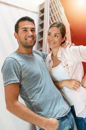 Portrait of a cute young couple in their new homeの写真素材
